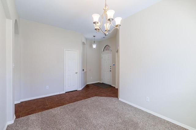 2532 Santa Barbara Loop, Round Rock, TX 78665 - tiled spare room with arched walkways, carpet floors, and a chandelier