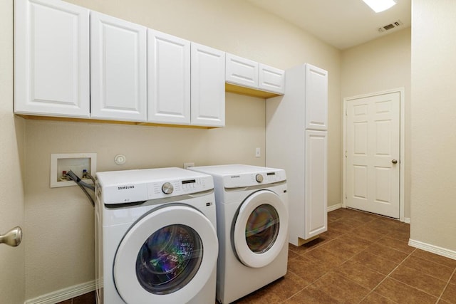 2532 Santa Barbara Loop, Round Rock, TX 78665 - laundry room featuring separate washer and dryer, baseboards, cabinet space, and dark tile patterned floors