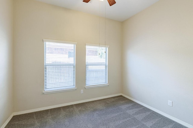2532 Santa Barbara Loop, Round Rock, TX 78665 - spare room with dark colored carpet, ceiling fan, and baseboards