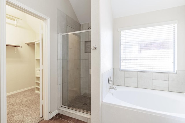 2532 Santa Barbara Loop, Round Rock, TX 78665 - bathroom featuring a garden tub, a stall shower, a spacious closet, plenty of natural light, and vaulted ceiling