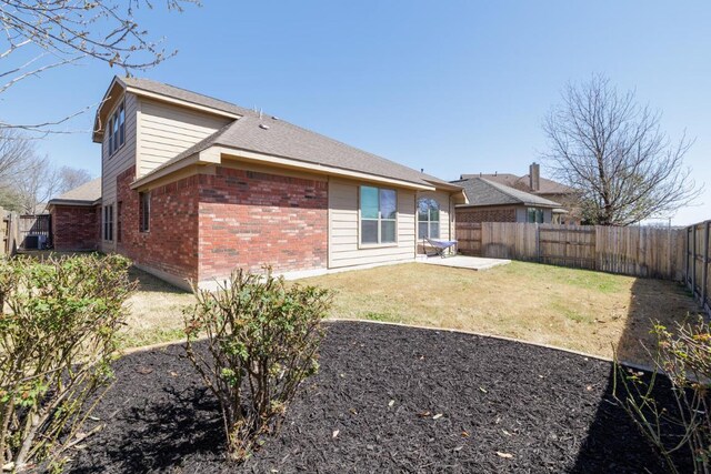 2532 Santa Barbara Loop, Round Rock, TX 78665 - back of property with brick siding and a patio area