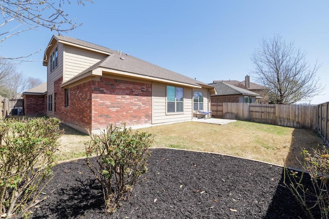 2532 Santa Barbara Loop, Round Rock, TX 78665 - rear view of house with brick siding, a fenced backyard, and a patio area