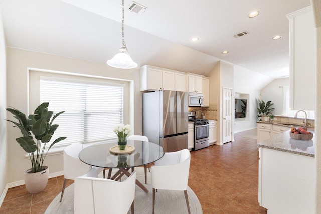 2532 Santa Barbara Loop, Round Rock, TX 78665 - dining space featuring lofted ceiling, recessed lighting, and baseboards