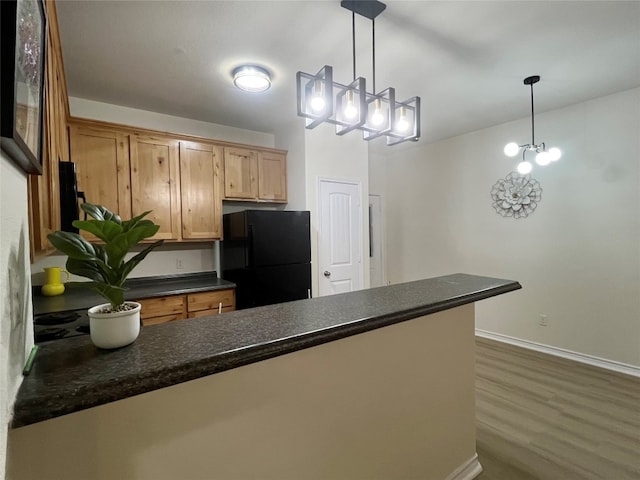 112 Flat Creek Dr, Robinson, TX 76706 - kitchen featuring freestanding refrigerator, dark countertops, baseboards, a chandelier, and dark wood-type flooring
