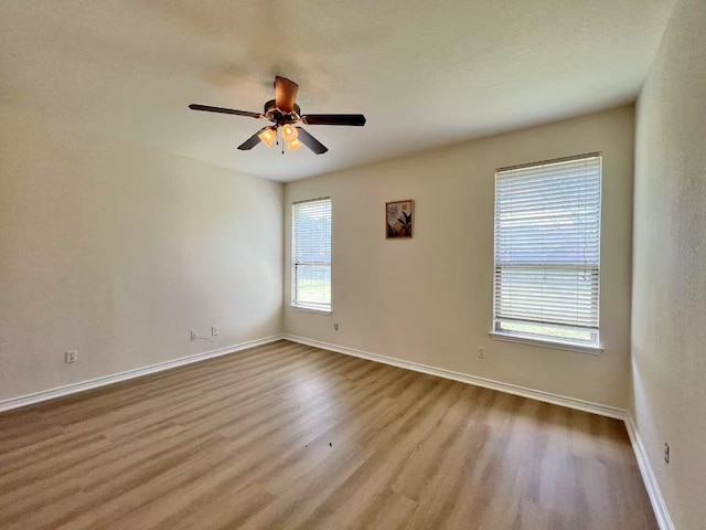112 Flat Creek Dr, Robinson, TX 76706 - empty room with wood finished floors, baseboards, and ceiling fan