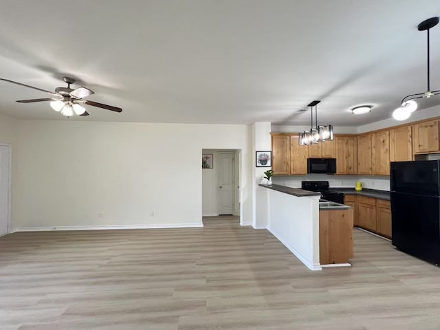 112 Flat Creek Dr, Robinson, TX 76706 - kitchen featuring black appliances, dark countertops, light wood-style floors, a peninsula, and ceiling fan