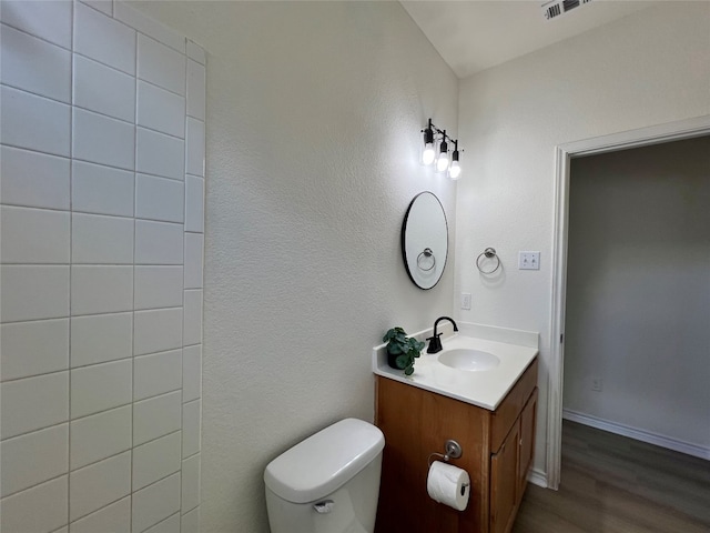 112 Flat Creek Dr, Robinson, TX 76706 - bathroom with vanity, toilet, wood finished floors, and baseboards