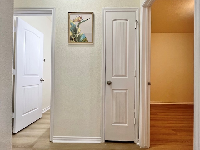 112 Flat Creek Dr, Robinson, TX 76706 - hallway with wood finished floors, baseboards, and a textured wall