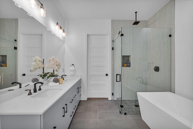 102 Mountain Home Rd, Horseshoe Bay, TX 78657 - full bathroom featuring a stall shower, double vanity, a freestanding bath, and tile patterned flooring