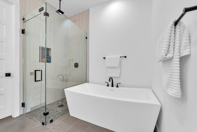 102 Mountain Home Rd, Horseshoe Bay, TX 78657 - bathroom with a soaking tub, a stall shower, and tile patterned floors