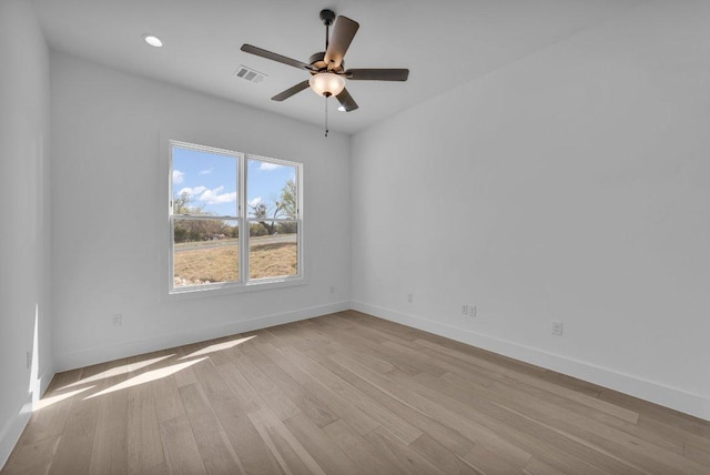 102 Mountain Home Rd, Horseshoe Bay, TX 78657 - spare room featuring baseboards, ceiling fan, wood finished floors, and recessed lighting