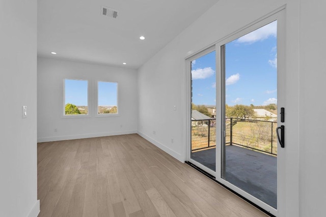 102 Mountain Home Rd, Horseshoe Bay, TX 78657 - empty room with light wood finished floors, plenty of natural light, baseboards, and recessed lighting