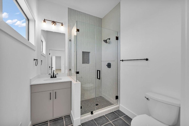 102 Mountain Home Rd, Horseshoe Bay, TX 78657 - bathroom with vanity, tile patterned flooring, toilet, a stall shower, and baseboards