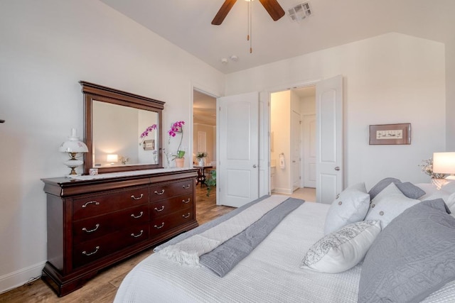 3204 Venezia Vw, Leander, TX 78641 - bedroom featuring light wood-type flooring, ensuite bath, and a ceiling fan