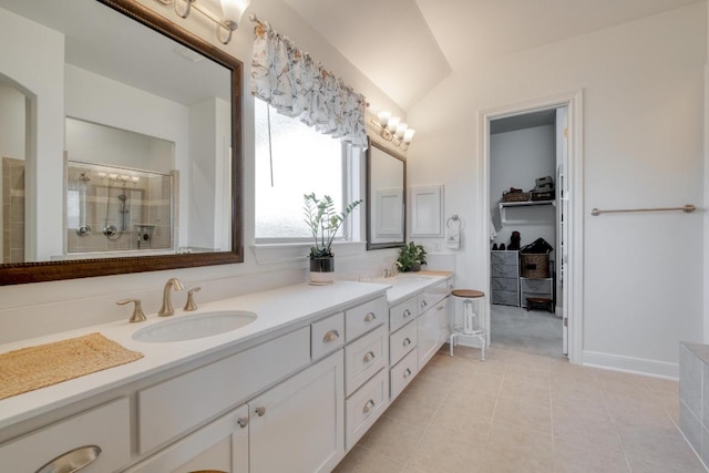 3204 Venezia Vw, Leander, TX 78641 - bathroom featuring double vanity, tile patterned flooring, and a shower