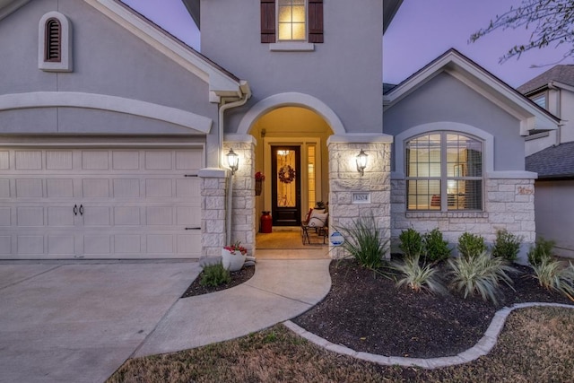 3204 Venezia Vw, Leander, TX 78641 - view of front of house featuring stucco siding, stone siding, concrete driveway, and a garage