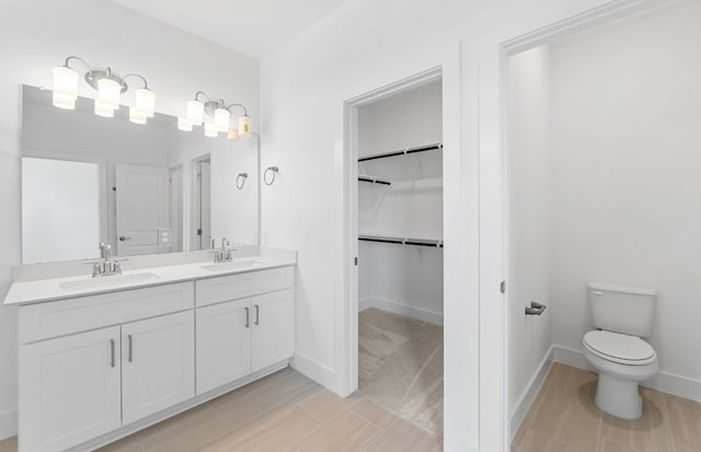 1955 Settlers Glen Dr Unit 5402, Round Rock, TX 78665 - full bath featuring toilet, a walk in closet, baseboards, and double vanity