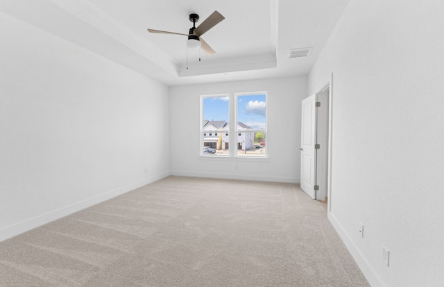 1955 Settlers Glen Dr Unit 5402, Round Rock, TX 78665 - unfurnished room featuring a tray ceiling, light colored carpet, a ceiling fan, and baseboards