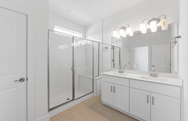 1955 Settlers Glen Dr Unit 5402, Round Rock, TX 78665 - full bath with a shower stall, double vanity, and wood finished floors