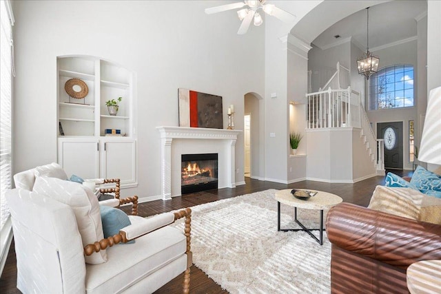 5201 Keene Cv, Austin, TX 78730 - living area with a high ceiling, crown molding, stairway, a ceiling fan, and built in features