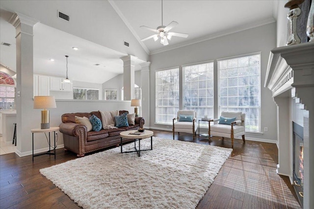 5201 Keene Cv, Austin, TX 78730 - living room featuring lofted ceiling, a ceiling fan, baseboards, dark wood-type flooring, and decorative columns