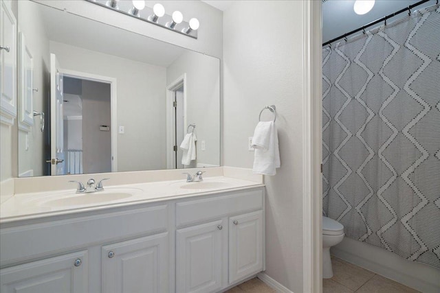 5201 Keene Cv, Austin, TX 78730 - full bathroom featuring double vanity, tile patterned floors, and a shower with shower curtain