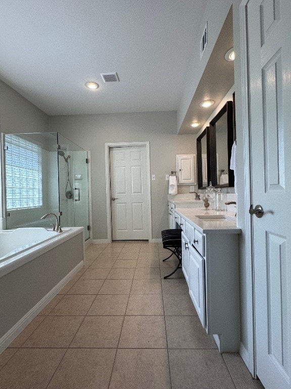 5201 Keene Cv, Austin, TX 78730 - full bathroom with vanity, a stall shower, a bath, tile patterned floors, and recessed lighting