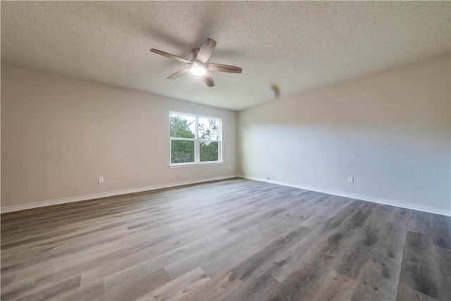 3901 Skipton Dr, Austin, TX 78727 - empty room with a ceiling fan, a textured ceiling, and wood finished floors