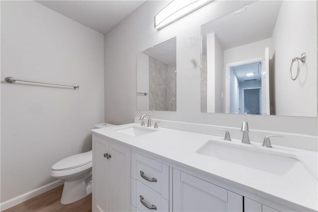 3901 Skipton Dr, Austin, TX 78727 - full bathroom with wood finished floors and double vanity