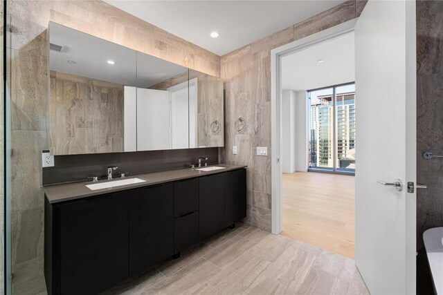 44 E Ave Unit 3203, Austin, TX 78701 - full bath featuring double vanity and recessed lighting