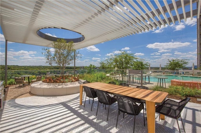 44 E Ave Unit 3203, Austin, TX 78701 - view of patio with outdoor dining space and a community pool