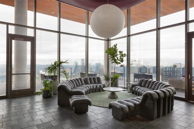 44 E Ave Unit 3203, Austin, TX 78701 - community lobby with a city view and a wall of windows
