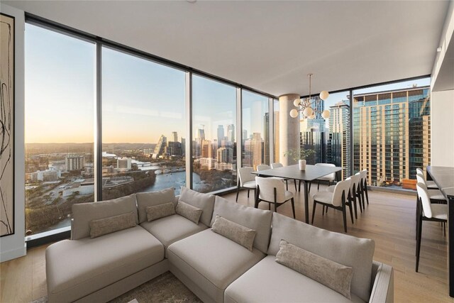 44 E Ave Unit 3203, Austin, TX 78701 - sunroom featuring a skyline view, healthy amount of natural light, and a chandelier