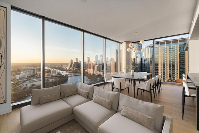 44 E Ave Unit 3203, Austin, TX 78701 - sunroom / solarium with a skyline view, healthy amount of natural light, and a chandelier