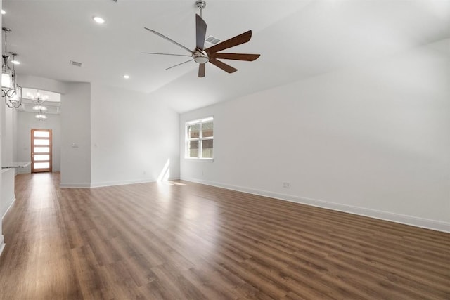 129 Du Bois Ln, Kyle, TX 78640 - unfurnished living room with healthy amount of natural light, a ceiling fan, wood finished floors, recessed lighting, and vaulted ceiling