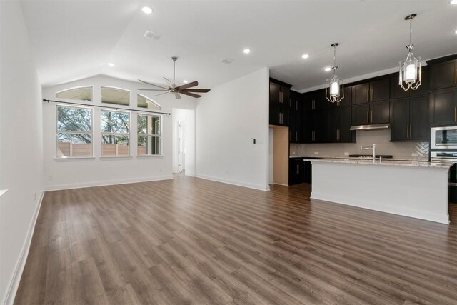 129 Du Bois Ln, Kyle, TX 78640 - kitchen featuring stainless steel appliances, open floor plan, under cabinet range hood, ceiling fan, and recessed lighting