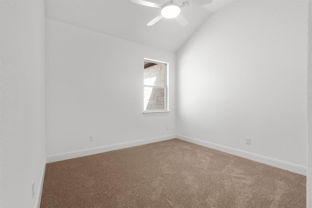 129 Du Bois Ln, Kyle, TX 78640 - spare room with vaulted ceiling, carpet flooring, ceiling fan, and baseboards