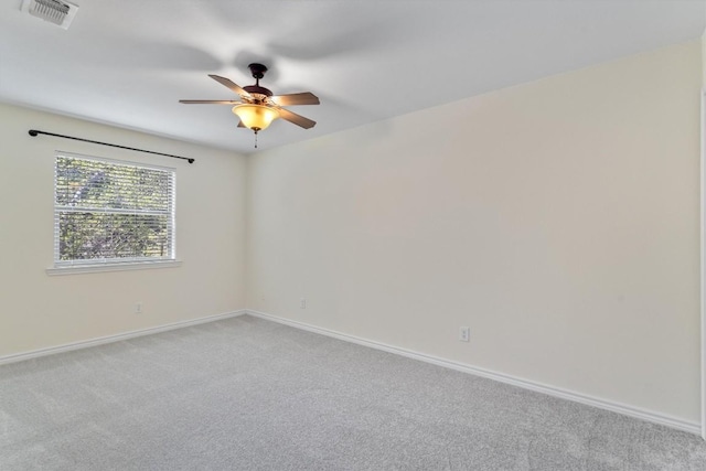 unfurnished room featuring ceiling fan, baseboards, and light carpet