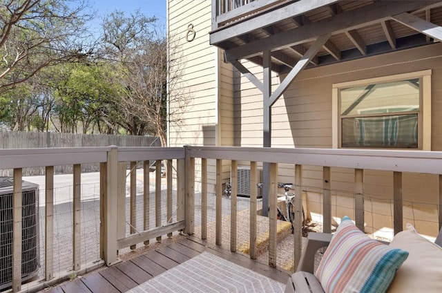 wooden terrace with fence and central air condition unit