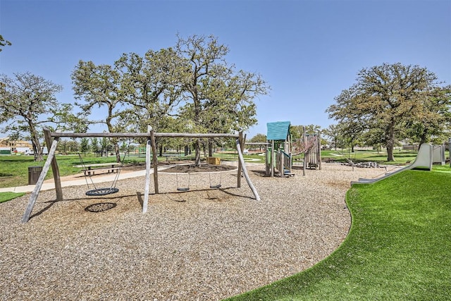 communal playground featuring a lawn