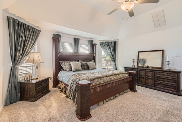 bedroom featuring baseboards, visible vents, light colored carpet, and a ceiling fan