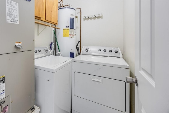 618 Bentwood Dr, Leander, TX 78641 - laundry room with heating unit, washer and clothes dryer, electric water heater, and laundry area