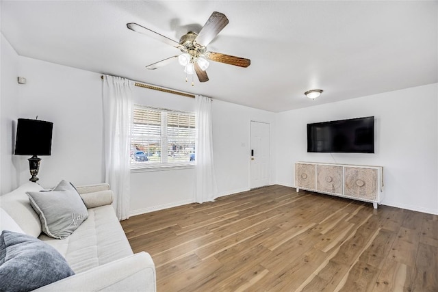 618 Bentwood Dr, Leander, TX 78641 - living room featuring baseboards, ceiling fan, and wood finished floors