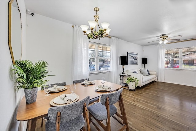 618 Bentwood Dr, Leander, TX 78641 - dining space with ceiling fan with notable chandelier, baseboards, and wood finished floors