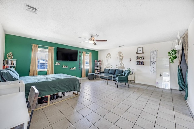 618 Bentwood Dr, Leander, TX 78641 - bedroom with light tile patterned flooring, multiple windows, ceiling fan, and visible vents