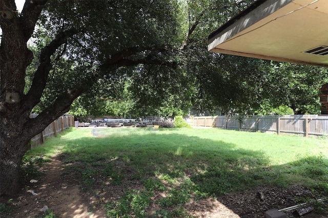 618 Bentwood Dr, Leander, TX 78641 - view of yard with a fenced backyard and visible vents