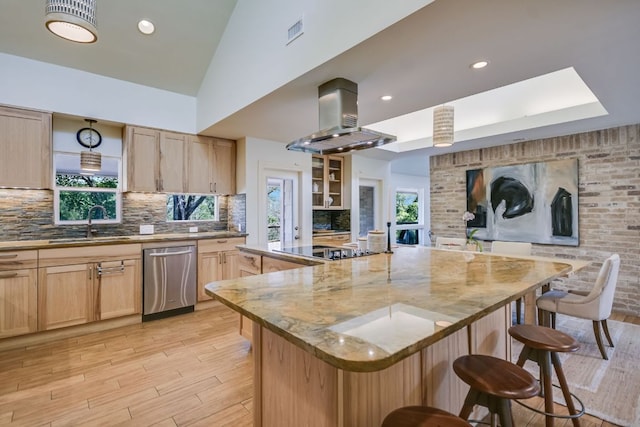 kitchen with light brown cabinets, a sink, island exhaust hood, and dishwasher
