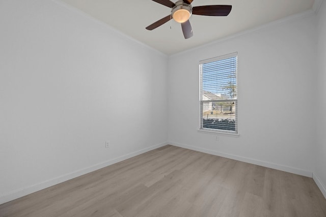 unfurnished room with light wood-style flooring, ceiling fan, baseboards, and ornamental molding