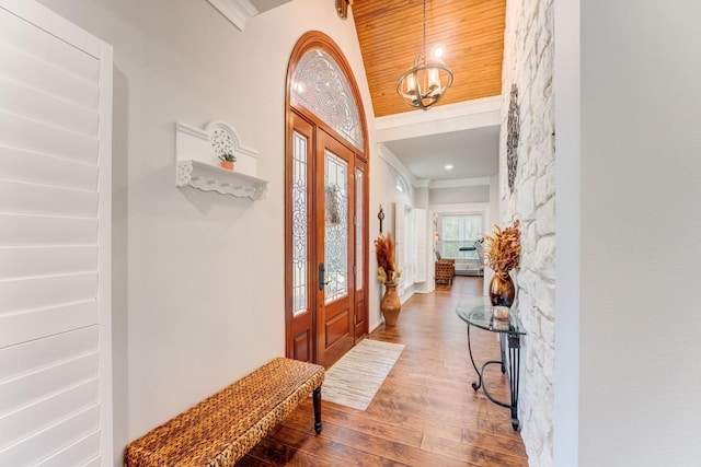14904 Oak Shores Dr, Willis, TX 77318 - entrance foyer with wood finished floors, crown molding, and a chandelier