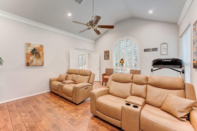 14904 Oak Shores Dr, Willis, TX 77318 - living area featuring light wood-style floors, a ceiling fan, plenty of natural light, lofted ceiling, and ornamental molding
